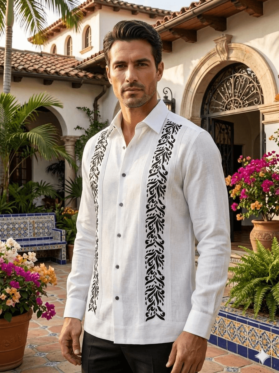 Camisa guayabera blanca de manga larga con llamativos bordados negros de motivos naturales en el pecho y pliegues tradicionales, presentada en un maniquí.